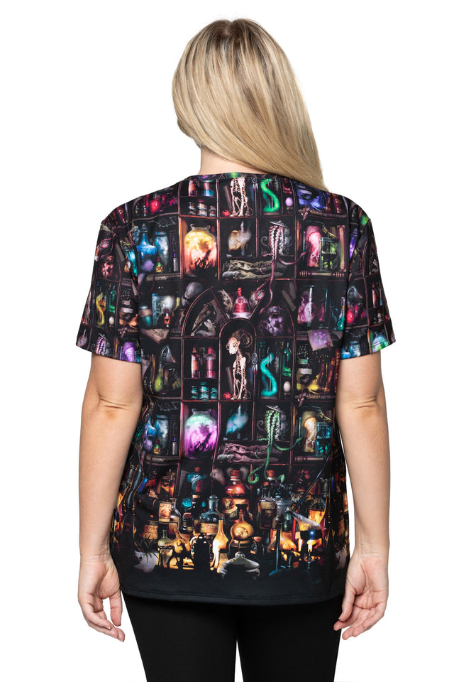 Person wearing a colorful graphic t-shirt with various images and text on a white background