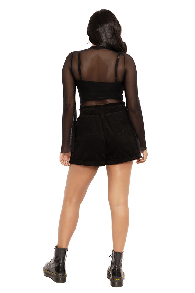 Gothic embroidered corduroy paper bag shorts featuring Ami Raithe’s moth artwork and dark forest-inspired insect details. A witchcore fashion staple with a relaxed fit, elasticated waistband and cuffed A-line silhouette, styled for dark academia, pagan aesthetic and whimsical goth outfits.