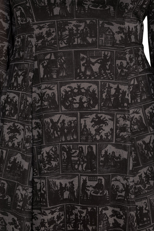 gothic mesh mini dress with comic-inspired witch artwork, sheer bishop sleeves and a romantic skater silhouette. This fantasy witch dress captures dark fairycore and alternative goth fashion with dramatic flowing details and occult inspired prints.
