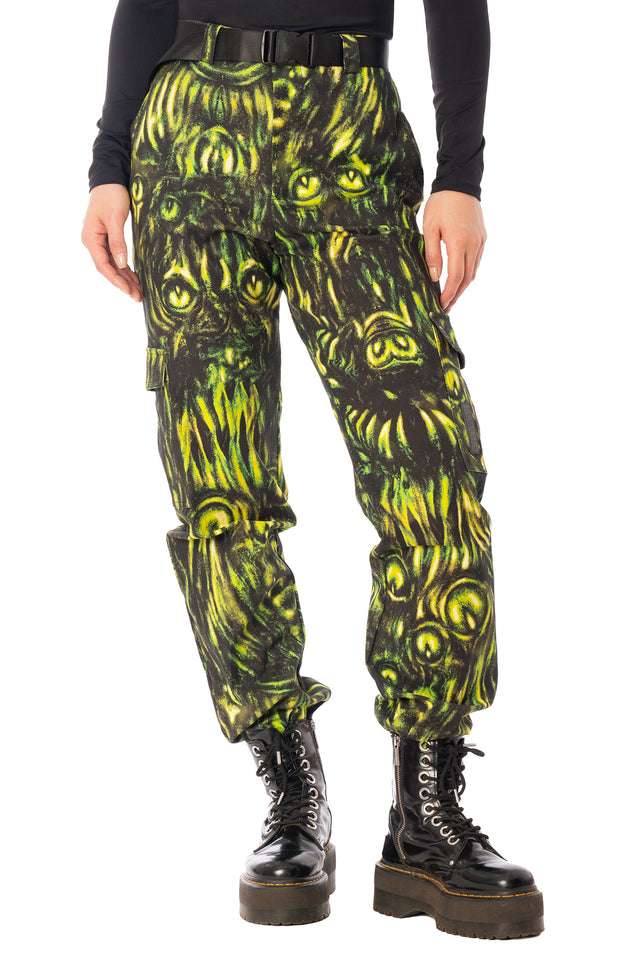 BlackMilk Mesmereyes Cargo Pants – green hypnotic eyeball print cotton cargo Halloween pants with vegan leather trims, part of the BlackMilk Clothing Halloween collection
