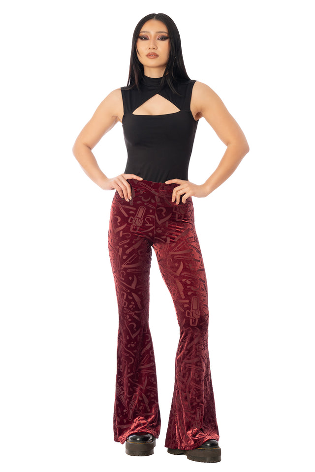 BlackMilk Slasher Burned Velvet Flare Pants – red horror slasher weapon print burned velvet high-waisted flare Halloween pants, part of the BlackMilk Clothing Halloween collection