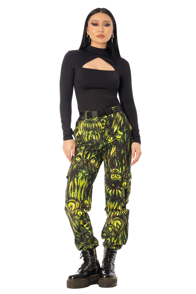 BlackMilk Mesmereyes Cargo Pants – green hypnotic eyeball print cotton cargo Halloween pants with vegan leather trims, part of the BlackMilk Clothing Halloween collection