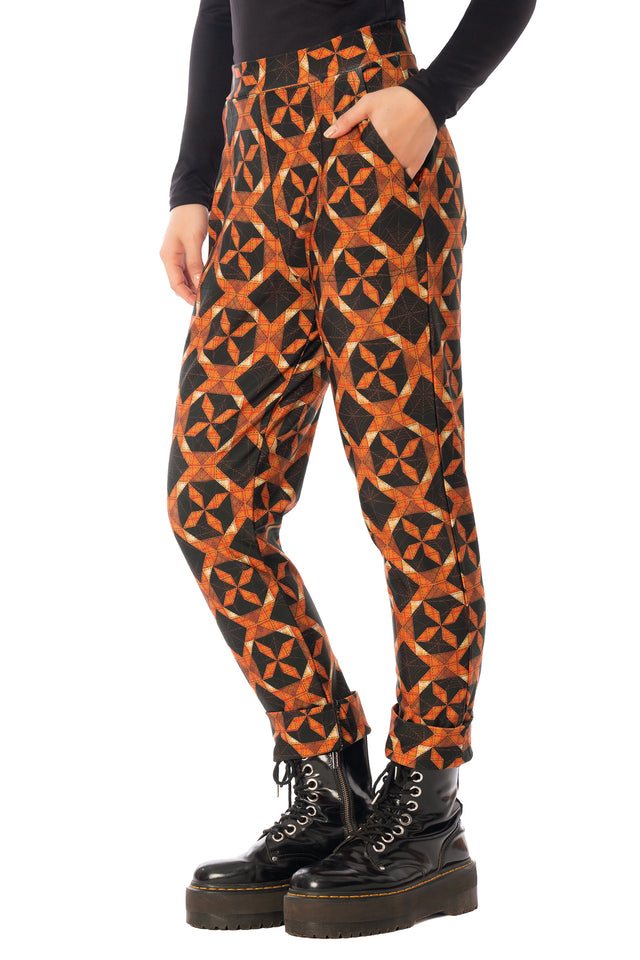 BlackMilk Pumpkin Patchwork Cuffed Pants – orange pumpkin and slasher print cuffed Halloween pants, part of the BlackMilk Clothing Halloween collection
