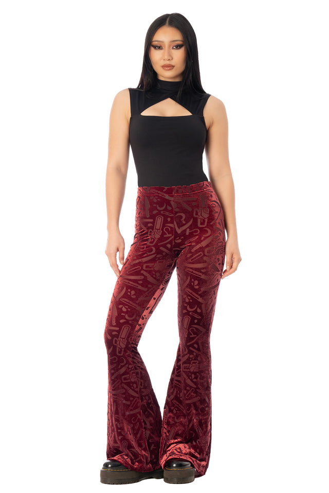 BlackMilk Slasher Burned Velvet Flare Pants – red horror slasher weapon print burned velvet high-waisted flare Halloween pants, part of the BlackMilk Clothing Halloween collection