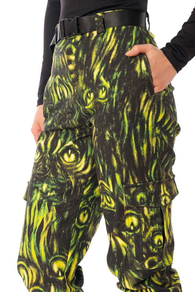 BlackMilk Mesmereyes Cargo Pants – green hypnotic eyeball print cotton cargo Halloween pants with vegan leather trims, part of the BlackMilk Clothing Halloween collection