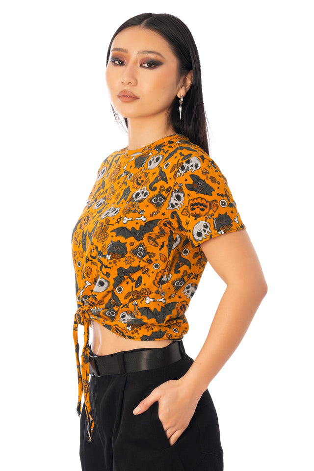 BlackMilk Bat to the Bone Cotton Tie Front Tee – orange Halloween skull, bat and pumpkin print tie-front tee, part of the BlackMilk Clothing Halloween collection