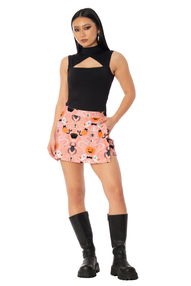 BlackMilk Coven Cutie Skort – pink witch, pumpkin and black cat Halloween print skort, part of the BlackMilk Clothing Halloween collection