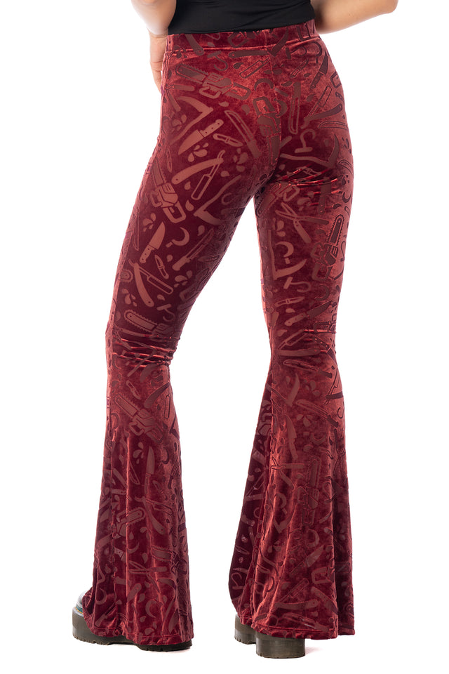 BlackMilk Slasher Burned Velvet Flare Pants – red horror slasher weapon print burned velvet high-waisted flare Halloween pants, part of the BlackMilk Clothing Halloween collection