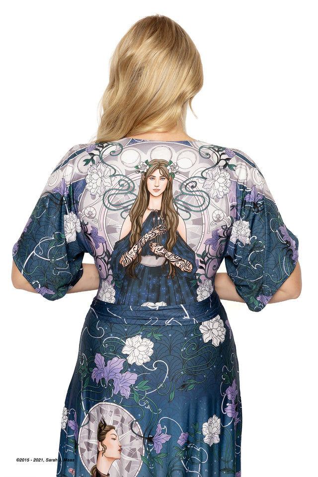 A Court of Thorns and Roses order series House of Archeron dress, ACOTAR kimono maxi dress by Sarah J Maas with Feyre, Nesta and Elain print, floral accents and full length flowing silhouette, fantasy fashion piece