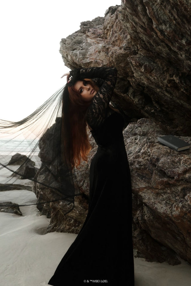 Gothic black velvet maxi dress with lace sleeves, the Abyss Lace Long Sleeve Velvet Maxi Dress features a dramatic floor length silhouette