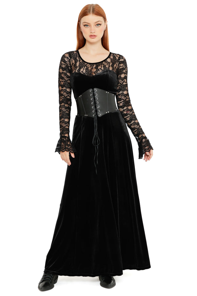 Model wearing the Abyss Lace Long Sleeve Velvet Maxi Dress, a black gothic maxi dress featuring sheer lace sleeves, velvet bodice and flowing full length skirt