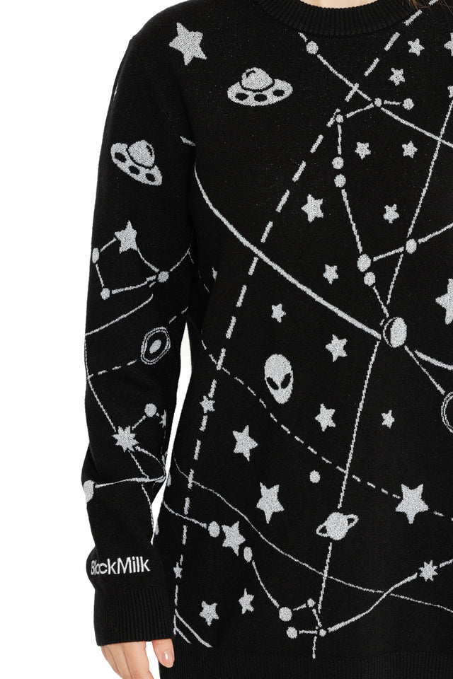 Black space jumper featuring star charts, planets and whimsical extraterrestrial illustrations