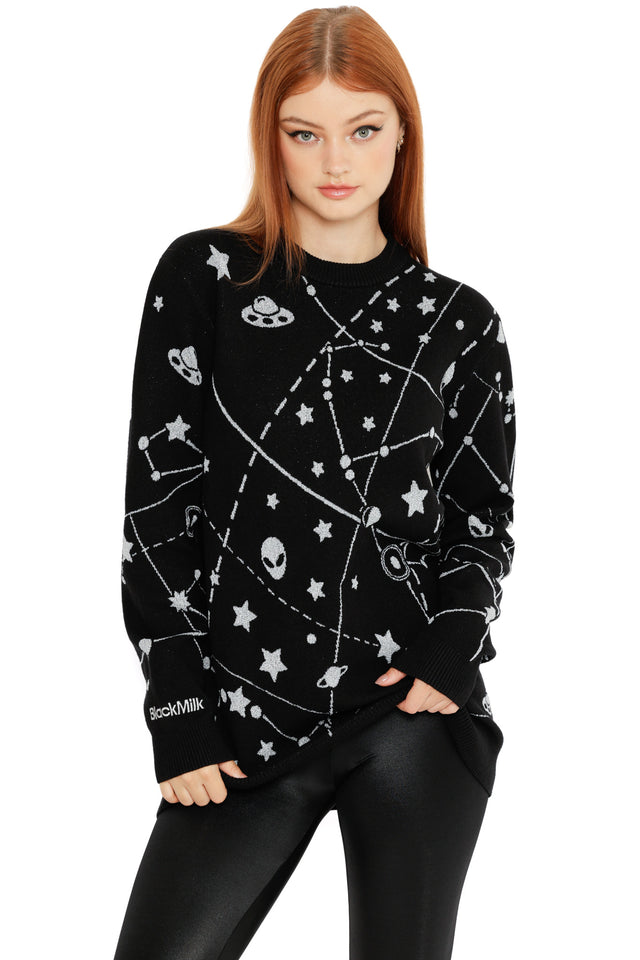 Cosmic constellation jumper in black with star patterns, orbit lines and alien symbols