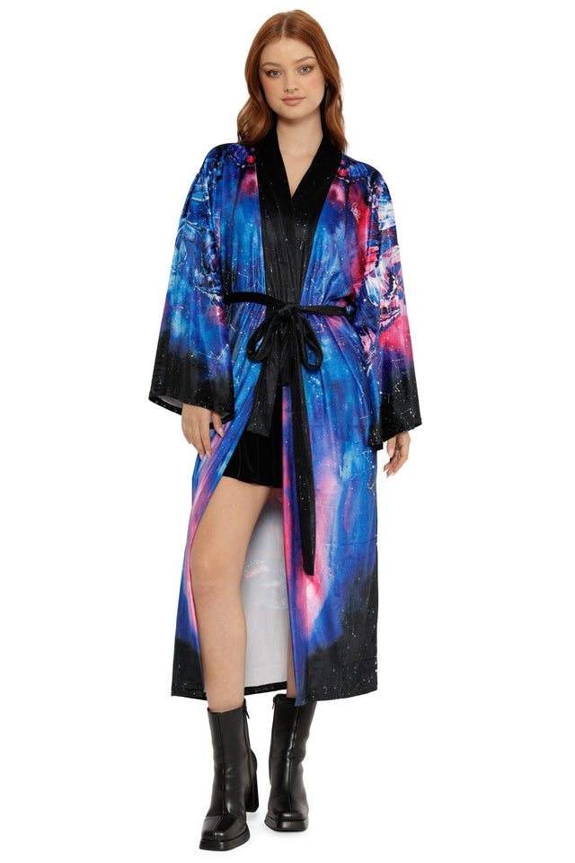 Woman wearing a colorful robe with a white background
