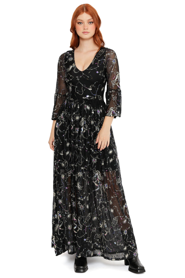 Statement black constellation dress with sheer sleeves, flowing skirt and cosmic detailing