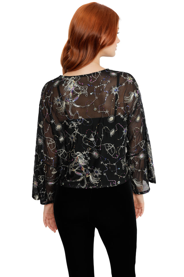 Space-inspired sheer top with star maps, constellation motifs and a relaxed cropped fit
