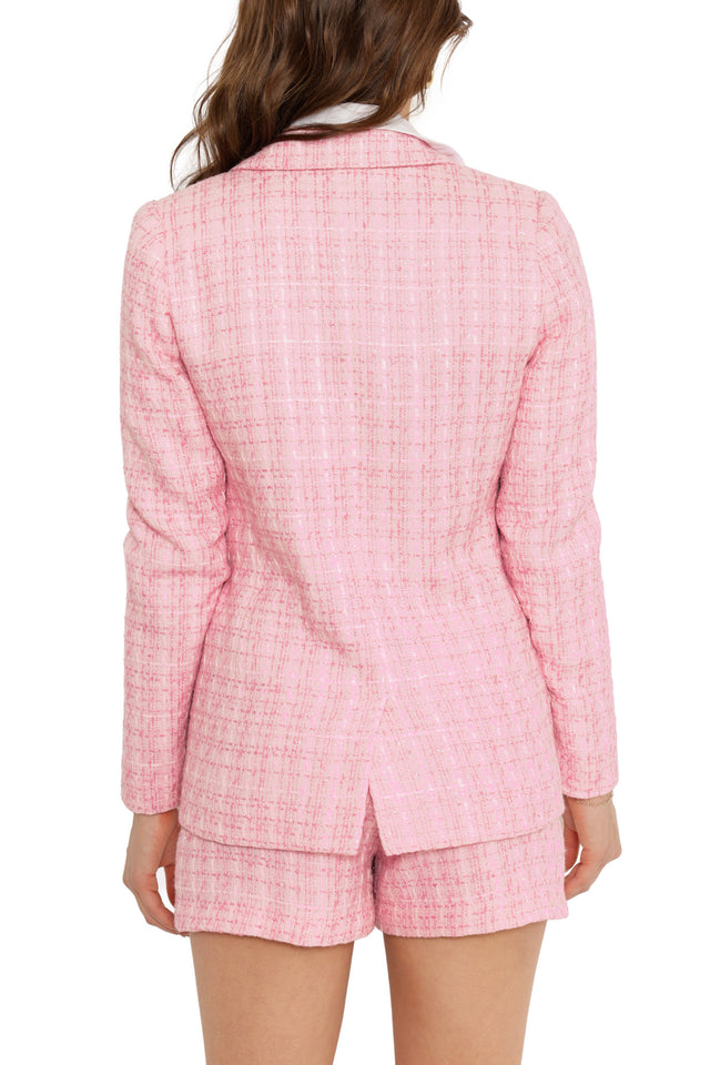 Pink checkered blazer worn by a person on a white background