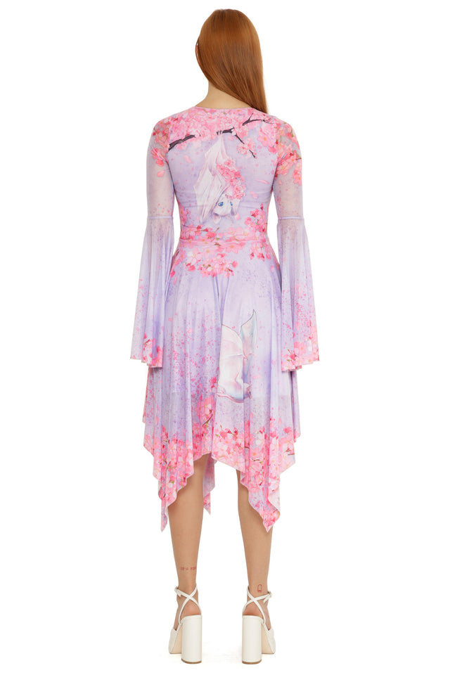 Pearl in Sakura Spectre Dress by Lora Zombie, worn full length to highlight the draped hem and fluid skirt panels.