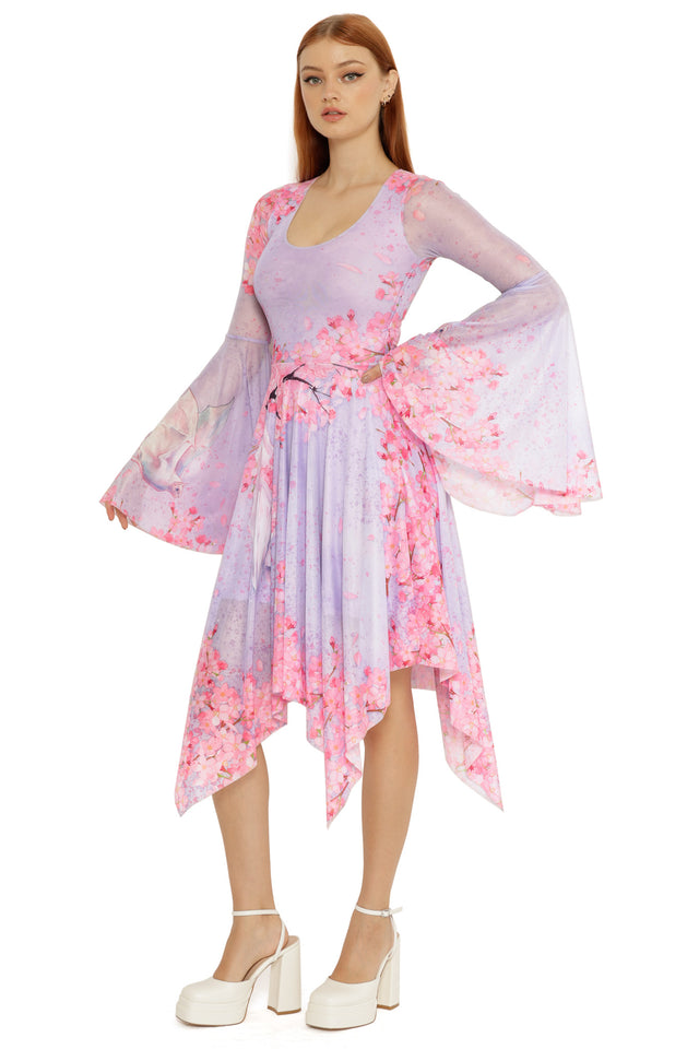 Handkerchief dress from the Lora Zombie collection showcasing a pastel lilac base with cherry blossom artwork and flowing illustrated details.