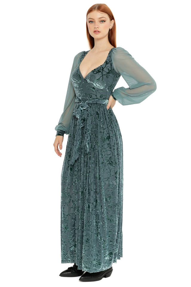 Detail view of the Be With Me Always Juniper Burned Velvet Maxi Dress, highlighting the sheer fabric, velvet floral pattern, plunging neckline and dramatic thigh split