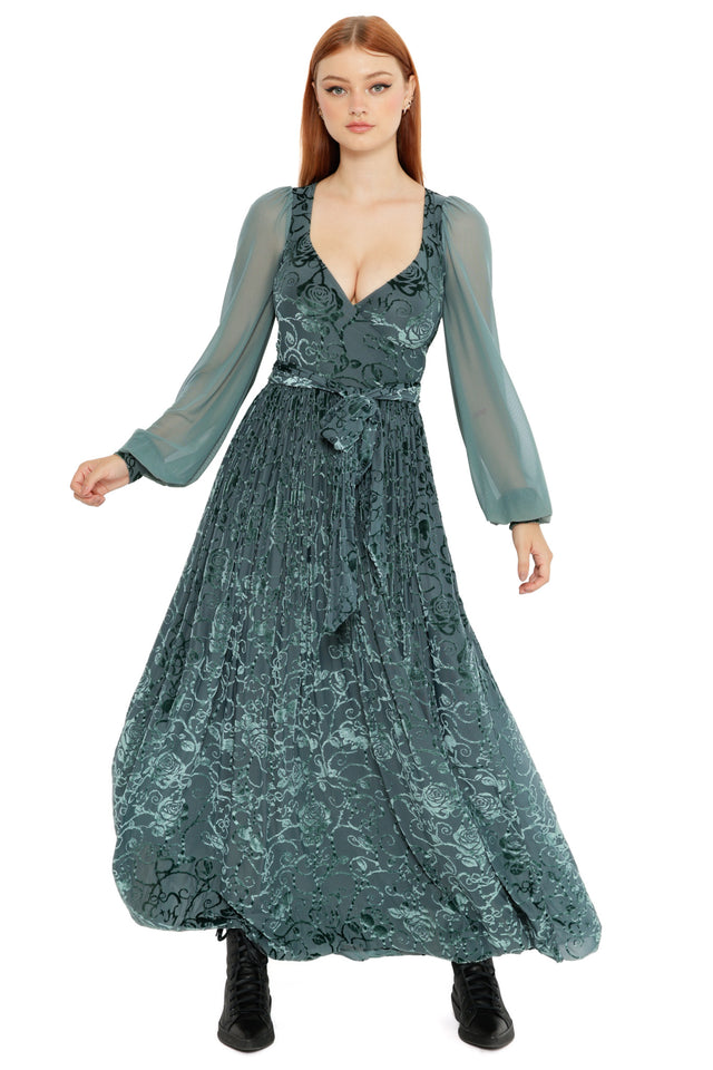 Close up styling of the Be With Me Always Juniper Burned Velvet Sheer Romance Maxi Dress, showcasing the sheer sleeve, floral velvet detailing and dramatic movement