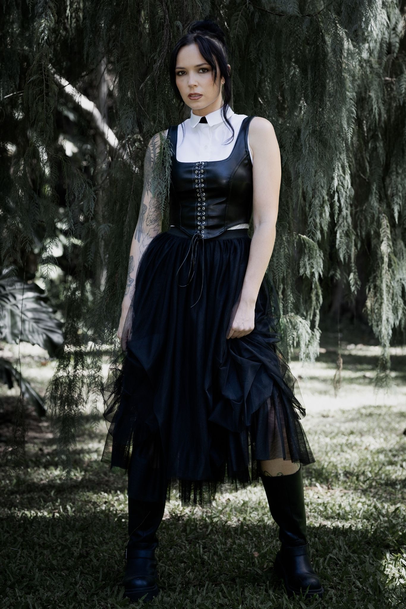 Gothic black tulle skirt featuring layered mesh fabric, a floaty midi silhouette and romantic ballerina inspired movement. Perfect for corporate goth, fantasy witch and dark academia outfits, this alternative skirt adds dramatic witchcore energy to any look.