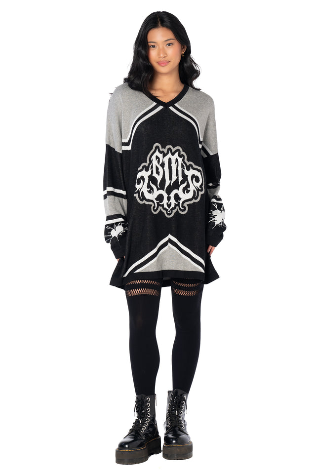 BlackMilk oversized hockey jersey featuring a classic sports-inspired silhouette, V-neck collar, contrast striped sleeves and broken heart graphics for alternative fashion lovers.