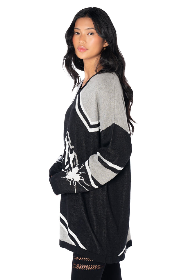 Relaxed fit black hockey-inspired jersey with a V-neckline, varsity stripe details, broken heart sleeve artwork and bold BlackMilk branding for everyday casual wear.