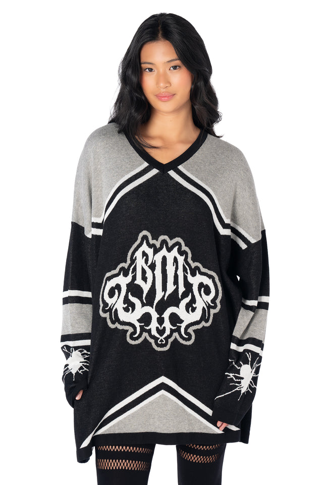 Alternative oversized hockey jersey crafted from soft knit fabric, featuring contrast striped sleeves, BlackMilk logo branding and statement broken heart graphics.