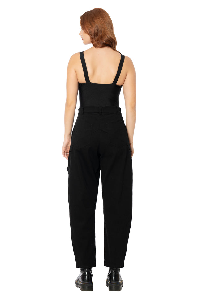 Alternative black cargo pants featuring a barrel leg silhouette, spacious functional pockets, scrunch seam detailing and soft cotton fabric for effortless everyday styling.