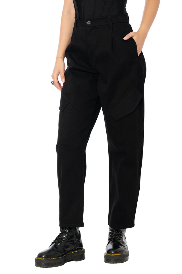 Utility-inspired black barrel leg pants with oversized cargo pockets, stretch cotton fabric and a relaxed fit, perfect for pairing with oversized tees, knits and fitted tops.