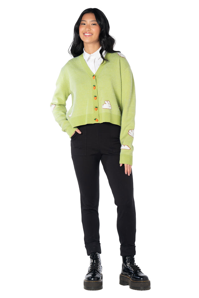 Cosy green cropped cardigan featuring an all-over knitted bunny design, charming carrot-shaped buttons and ultra-soft yarn, creating the perfect layering piece for cottagecore, kawaii and whimsical everyday outfits.