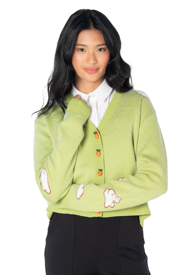 Cute cropped cardigan featuring fluffy bunny knit artwork, carrot-shaped button closures and a cosy green knit perfect for cottagecore and kawaii fashion.