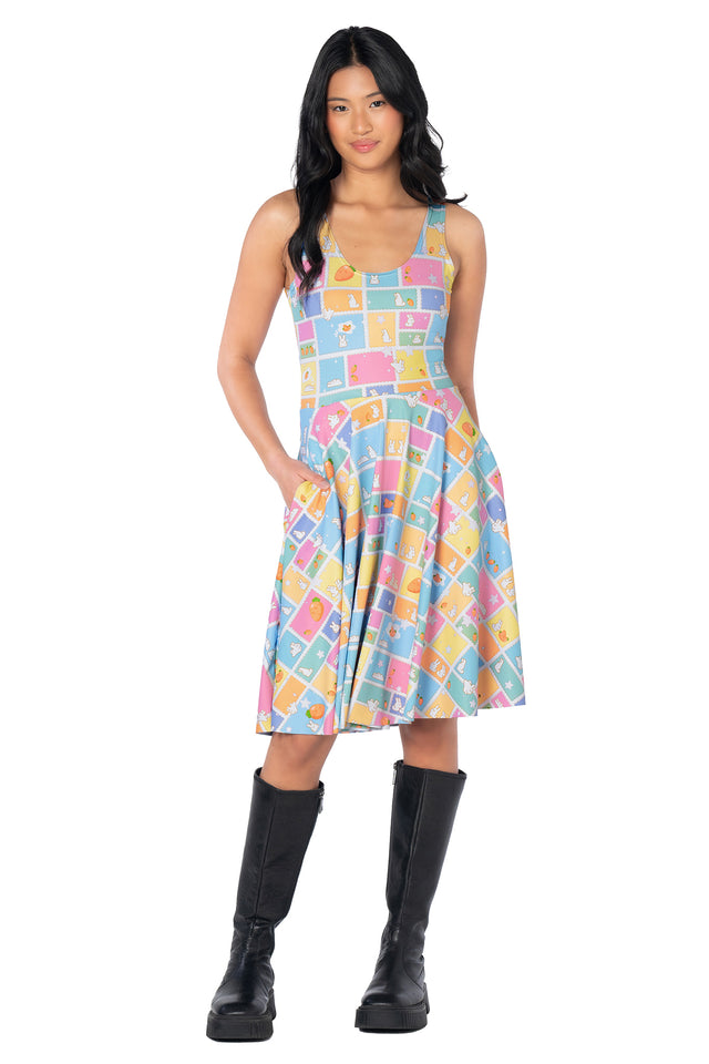 Kawaii-inspired bunny print tee dress with an all-over design of rabbit postage stamps, carrots, stars and fluffy clouds, finished with a relaxed longline silhouette and pockets.