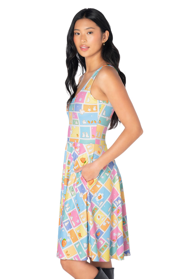 Women's pastel rabbit print longline dress featuring playful bunny stamp graphics, soft stretch fabric, knee-length silhouette and hidden side pockets for everyday comfort.