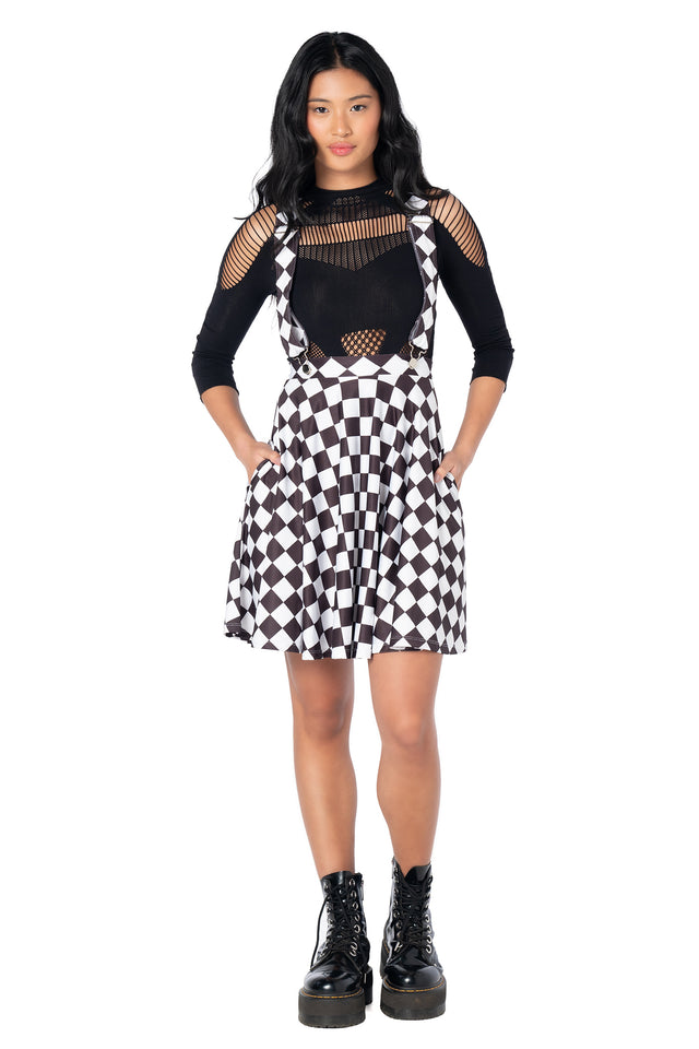 Retro-style black suspender skater dress with adjustable removable straps, flattering silhouette and vintage pin-up inspired styling for casual outfits.