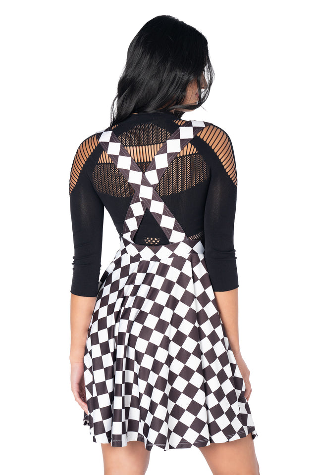 Black skater dress with detachable suspender straps, flattering fit-and-flare silhouette and retro-inspired styling perfect for everyday wear.