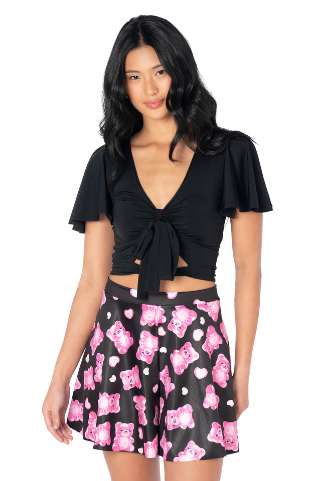 Colourful Rio shorts featuring an all-over gummy bear skeleton print, shiny Luxe fabric, flouncy silhouette and a comfortable pull-on design for playful summer styling.