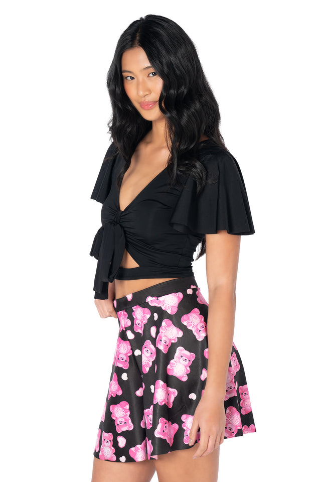 BlackMilk Rio shorts showcasing playful gummy bear skeleton illustrations, shiny stretch fabric, an easy pull-on fit and flowing unhemmed hems for carefree movement.
