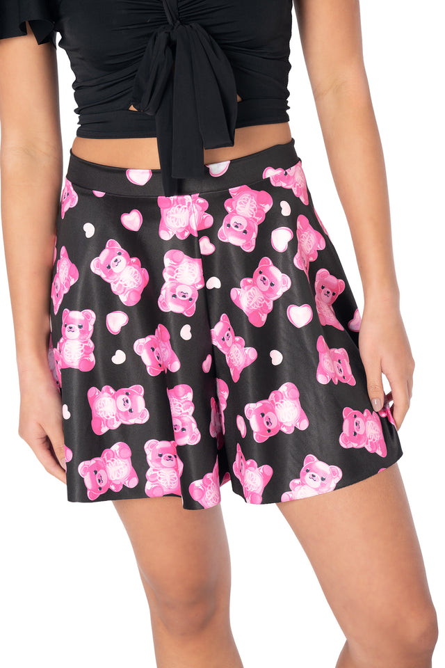 Playful gummy bear skeleton print Rio shorts crafted from lightweight shiny Luxe fabric with a relaxed flouncy silhouette and comfortable pull-on waistband for casual wear.