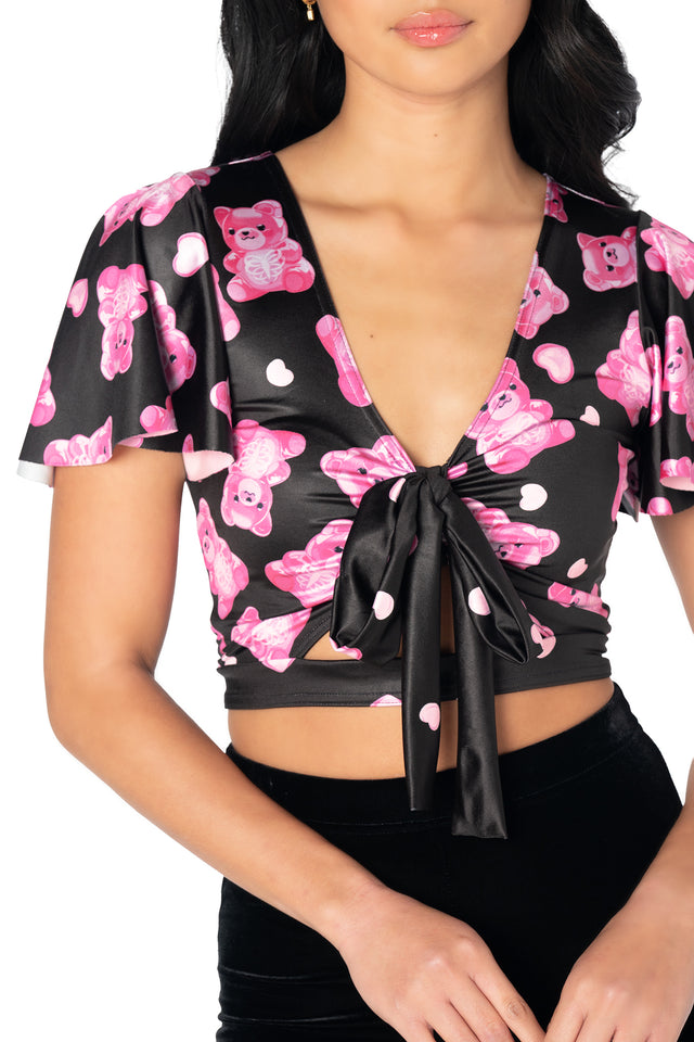 Colourful gummy bear print Rio top with shiny stretch fabric, flounced cap sleeves, front cut-out and a removable tie that can be styled around the neck or in your hair.