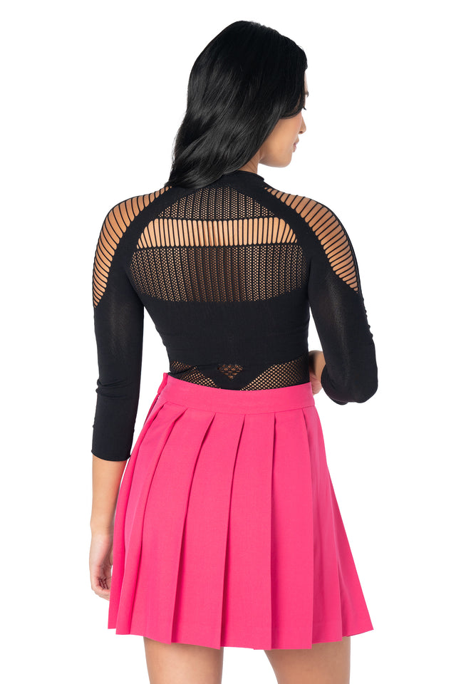 Bright pink pleated mini skirt with a flirty A-line silhouette, lightweight woven fabric and side button detail, perfect for Y2K, preppy and alternative fashion.