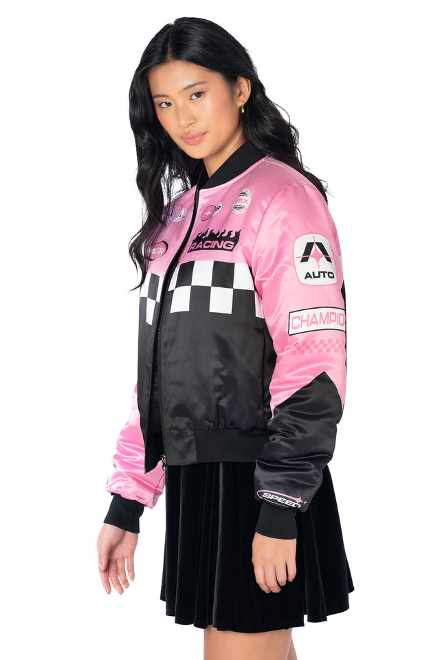 Women's oversized racing jacket featuring holographic motorsport graphics, striped sleeve detailing, statement back design, zip closure and a relaxed fit perfect for layering.