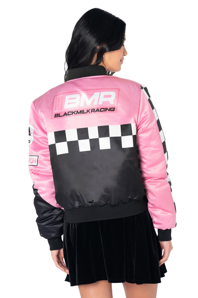 Motorsport-style oversized jacket with holographic detailing, bold racing graphics, relaxed fit, functional pockets and zip front closure for everyday alternative fashion.