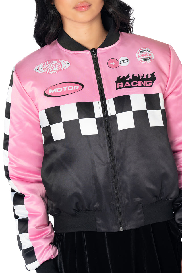 Black racing-inspired zip-up jacket with holographic logo patches, sporty stripe details, oversized relaxed silhouette and statement motorsport graphics, perfect for casual streetwear and Y2K-inspired outfits.