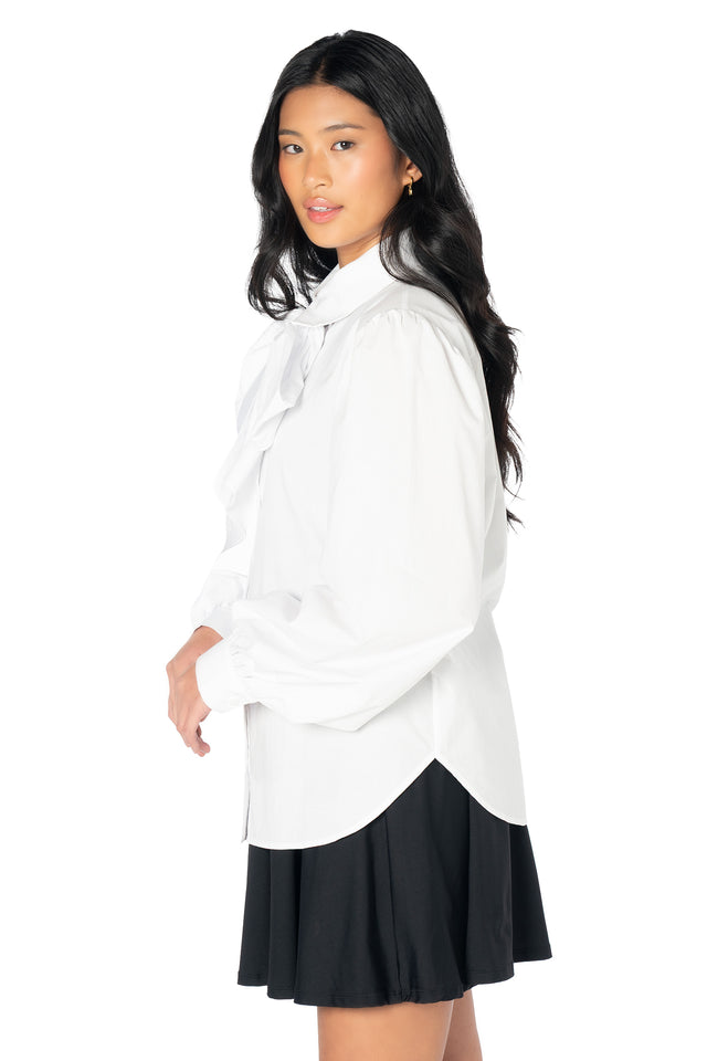 White woven blouse featuring a removable bow tie detail, voluminous sleeves and a classic button-up design for feminine, vintage-inspired and coquette fashion looks.