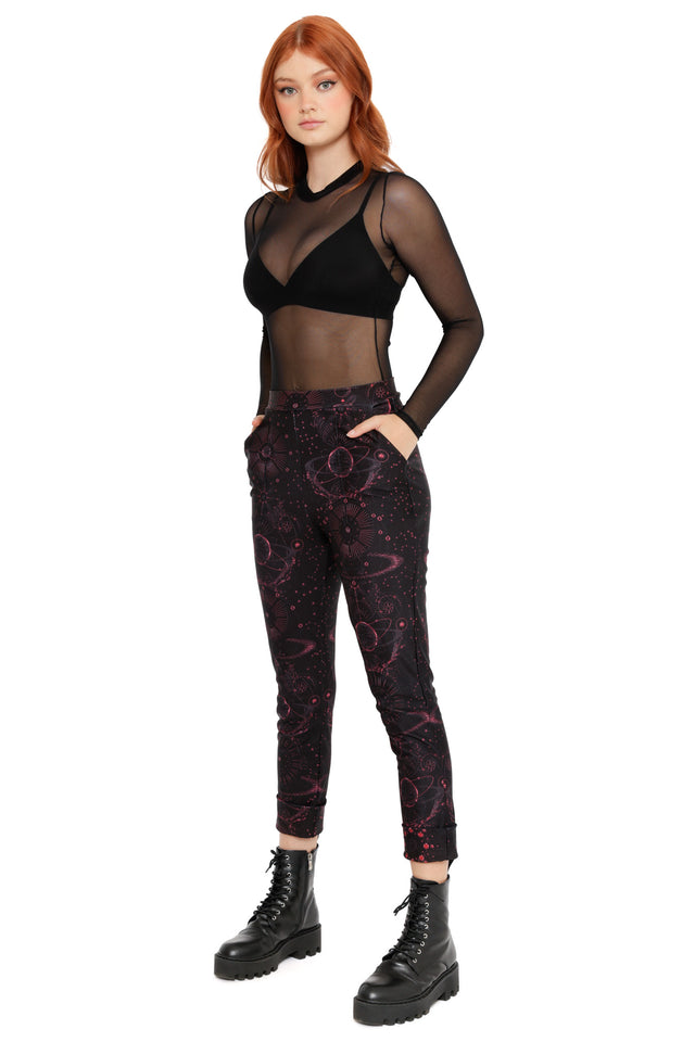 Space-inspired cuffed pants with dark galaxy artwork, red planetary motifs and a comfortable high-waist design