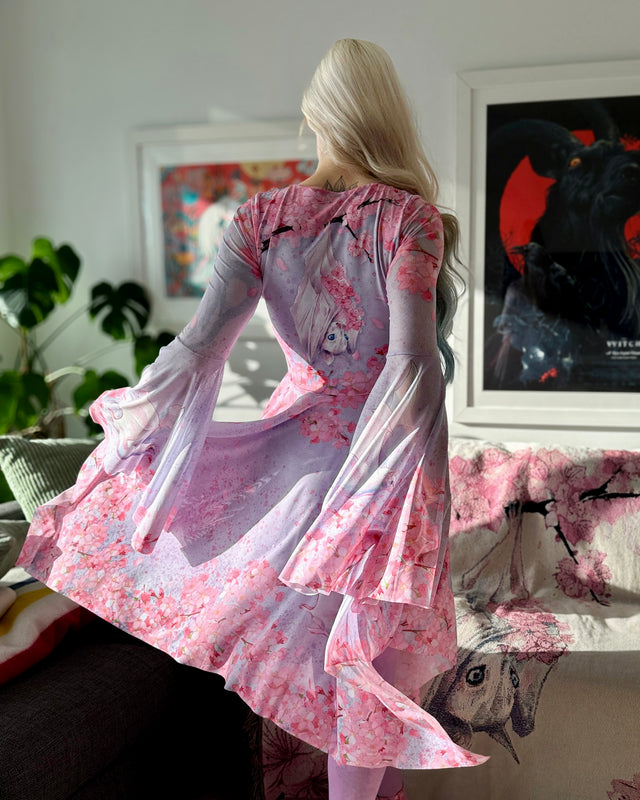 Asymmetric handkerchief hem dress from the Lora Zombie collection, detailed with delicate florals and pastel artwork.
