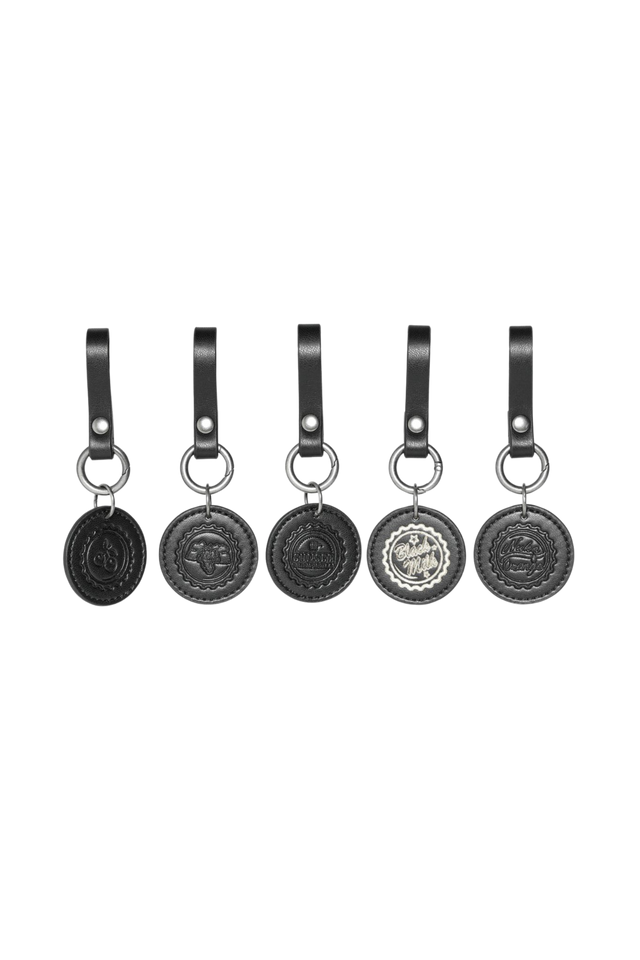 Set of five Fallout x BlackMilk Cap Currency charms made from black faux leather with embossed bottle cap logos.
