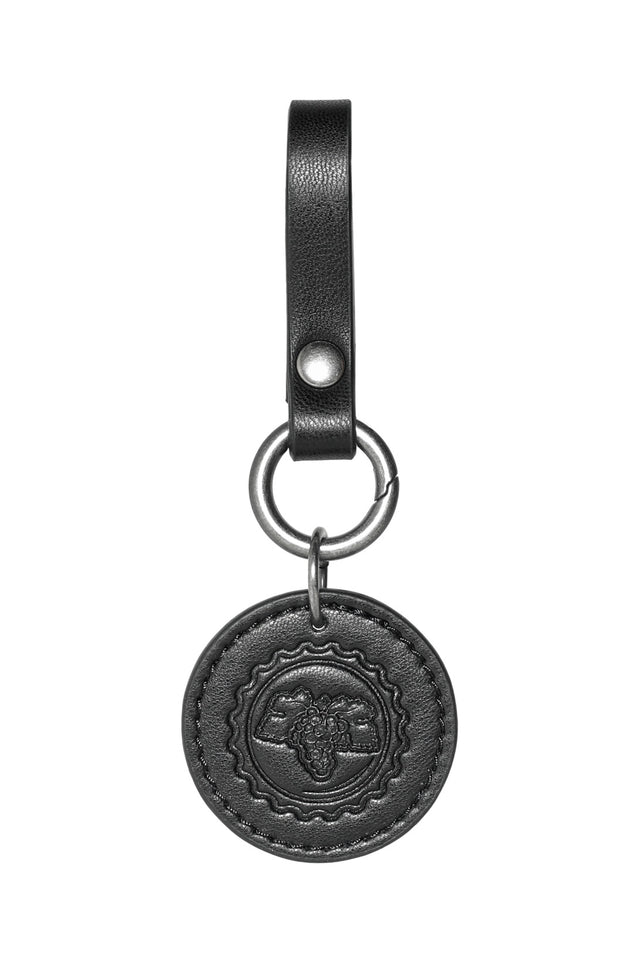 Fallout x BlackMilk Cap Currency accessory set showing detailed bottle cap emblems and metal hardware.